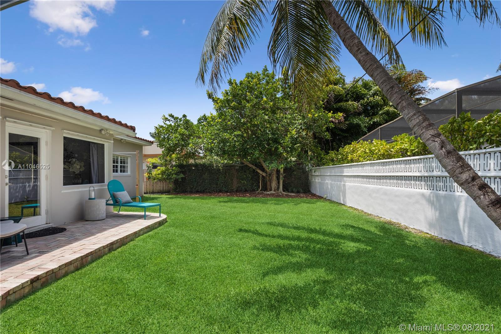 5750 Alton Road Miami Beach, FL 33140 - Photo 18 of 21 a view of a house with backyard and sitting area
