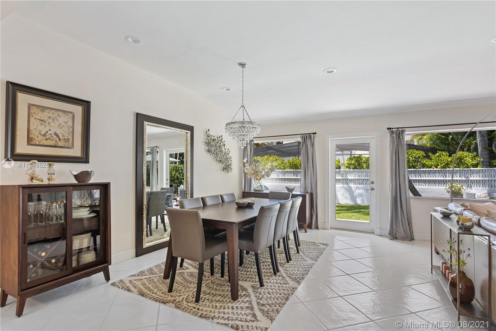 5750 Alton Road Miami Beach, FL 33140 - Photo 6 of 21 a dining room with furniture and window