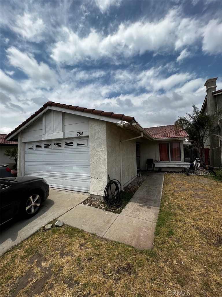 754 West Home Street Rialto, CA 92376 - Photo 1 of 1 a view of a car park in front of house
