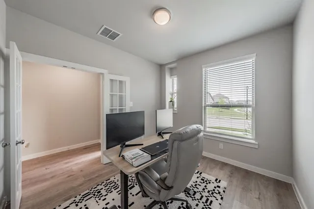 a workspace with furniture and a window
