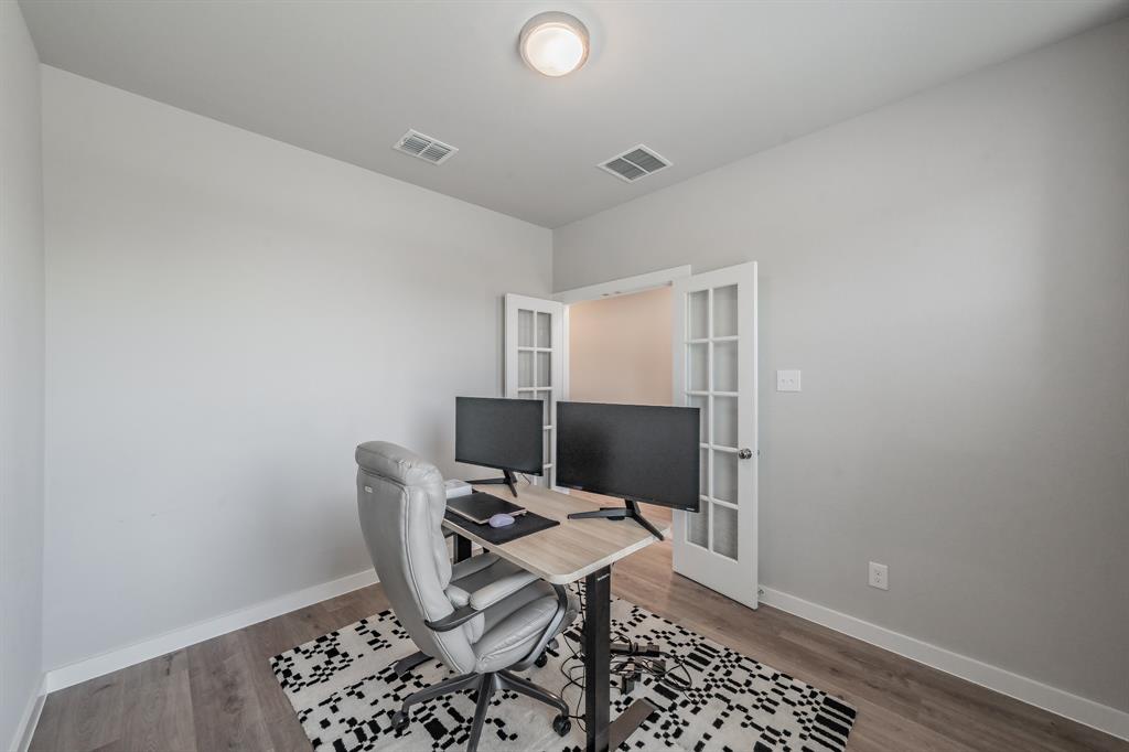 3202 Glorioso Drive Royse City, TX 75189 - Photo 14 of 40 a workspace with furniture and wooden floor