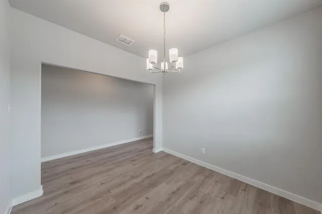 a bathroom with a sink toilet and a mirror
