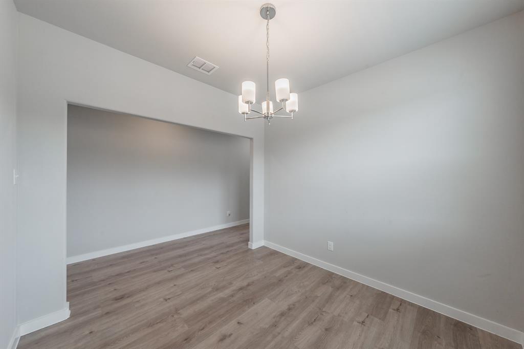 3202 Glorioso Drive Royse City, TX 75189 - Photo 18 of 40 a view of a chandelier in a room