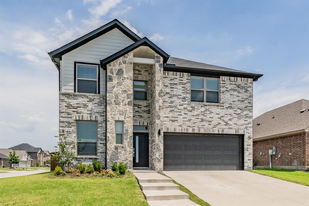 3202 Glorioso Drive Royse City, TX 75189 - Photo 2 of 40 a front view of a house with garden