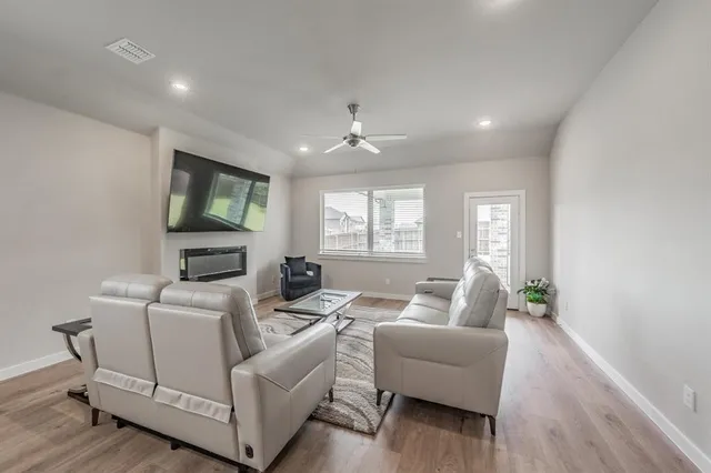 a spacious bedroom with a bed and a window