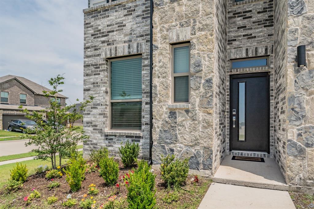 3202 Glorioso Drive Royse City, TX 75189 - Photo 3 of 40 front view of a brick house with a small yard