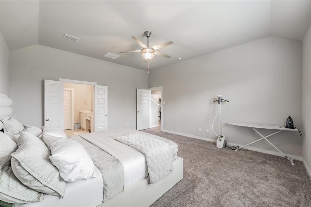 3202 Glorioso Drive Royse City, TX 75189 - Photo 32 of 40 a bedroom with a bed and a ceiling fan
