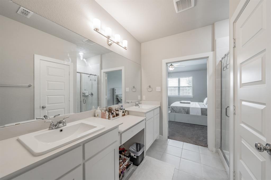 3202 Glorioso Drive Royse City, TX 75189 - Photo 35 of 40 a spacious bathroom with a double vanity sink mirror and bathtub