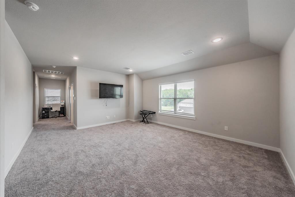 3202 Glorioso Drive Royse City, TX 75189 - Photo 36 of 40 an empty room with windows and pillars in it