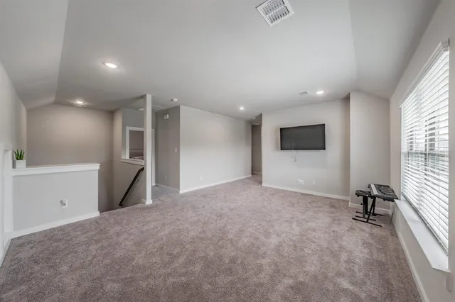 a bedroom with a bed and a mirror