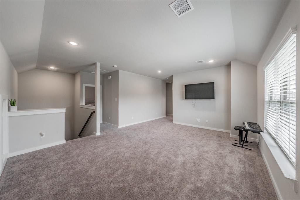 3202 Glorioso Drive Royse City, TX 75189 - Photo 37 of 40 a view of an empty room with a window and a kitchen