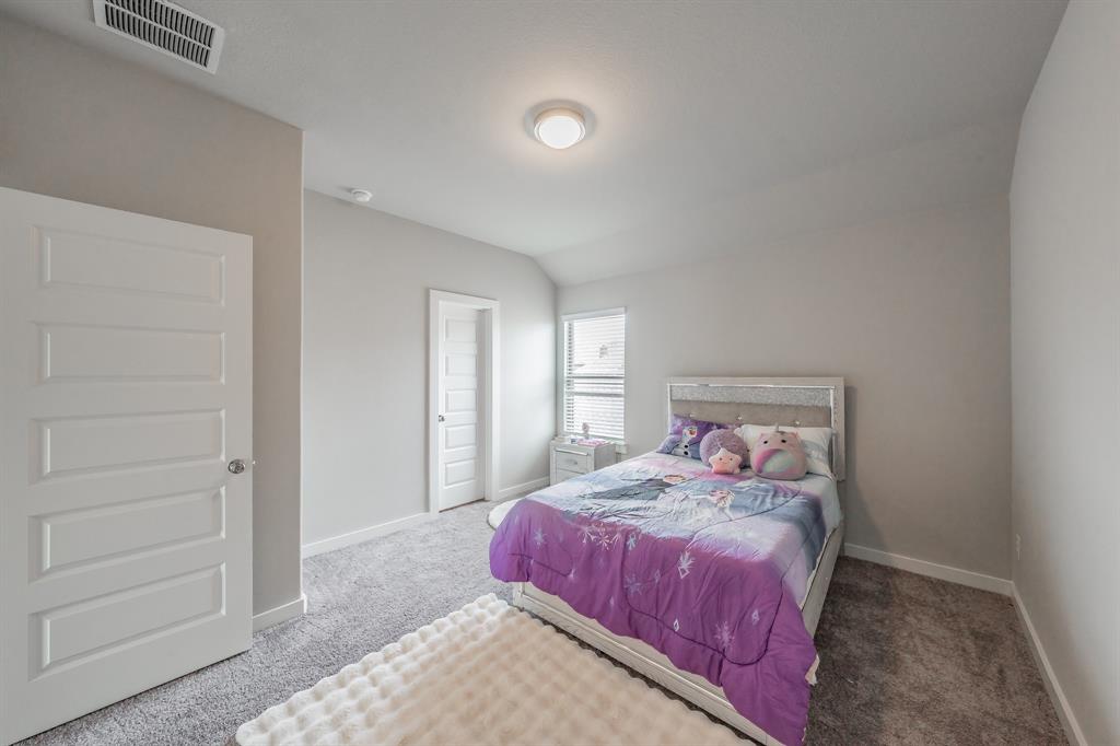 3202 Glorioso Drive Royse City, TX 75189 - Photo 38 of 40 a bedroom with a bed and a window