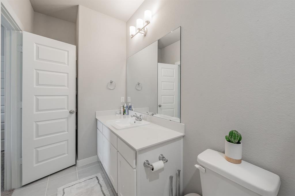 3202 Glorioso Drive Royse City, TX 75189 - Photo 40 of 40 a bathroom with a sink and a mirror