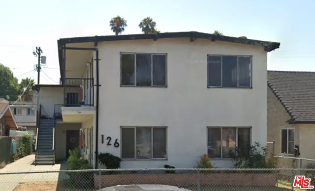 a view of a house with a small yard