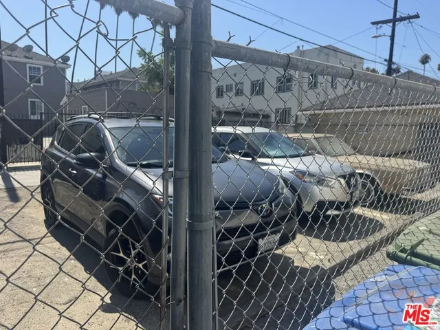 a view of a pathway of a house with a yard