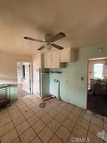 a room with a bed and a chandelier