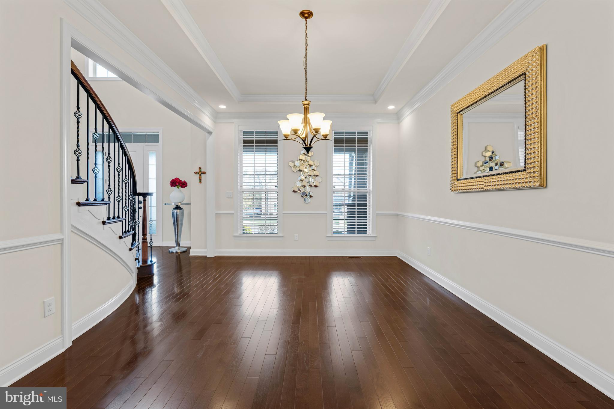 1045 Matthew Way New Castle, DE 19720 - Photo 17 of 62 a view of a room with wooden floor chandelier and windows