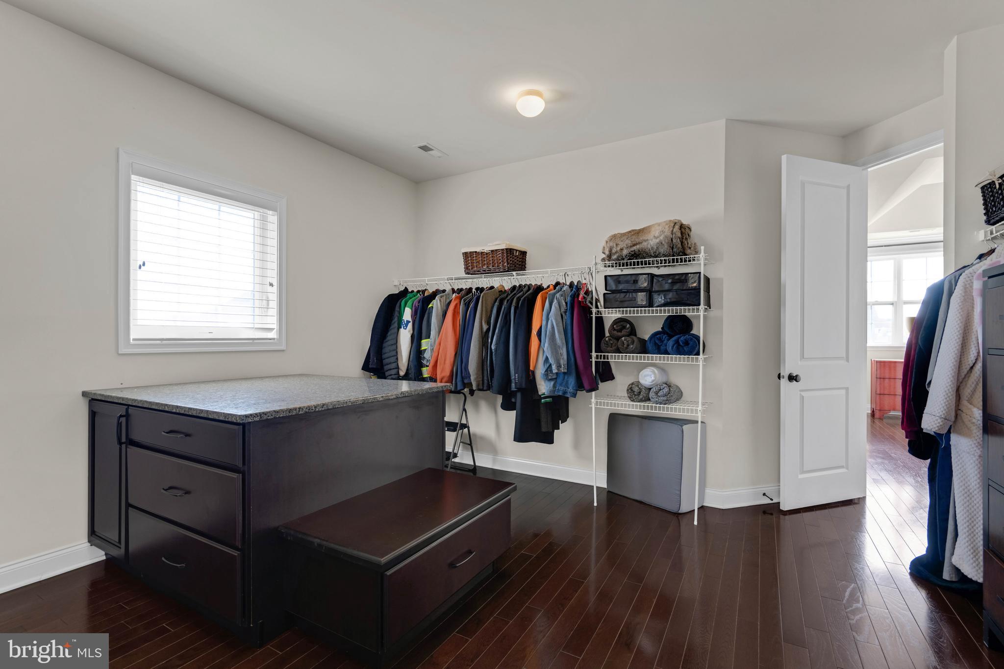 1045 Matthew Way New Castle, DE 19720 - Photo 29 of 62 a view of walk in closet with clothes and shoes