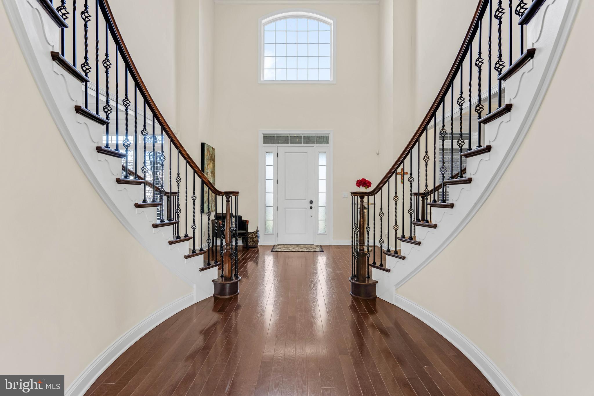 1045 Matthew Way New Castle, DE 19720 - Photo 3 of 62 a view of staircase with wooden floor and a chandelier