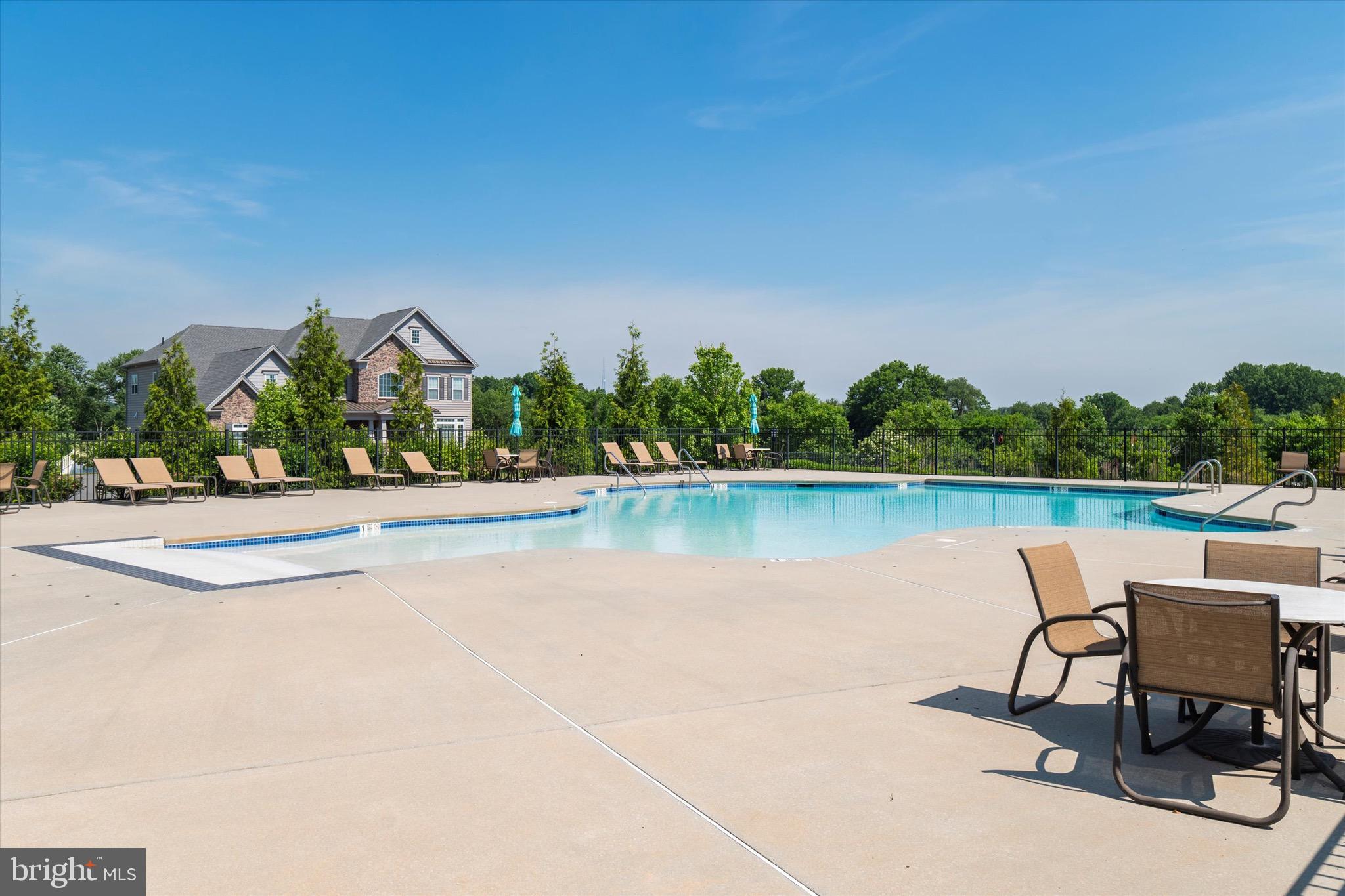 1045 Matthew Way New Castle, DE 19720 - Photo 61 of 62 a view of a lake with a table and chairs