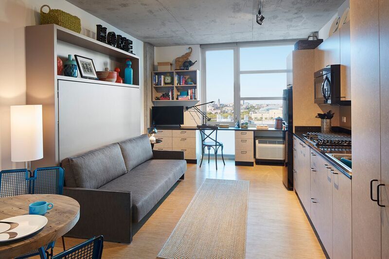 Undisclosed Address Chicago, IL 60642 - Photo 5 of 9 a living room with furniture and a large window