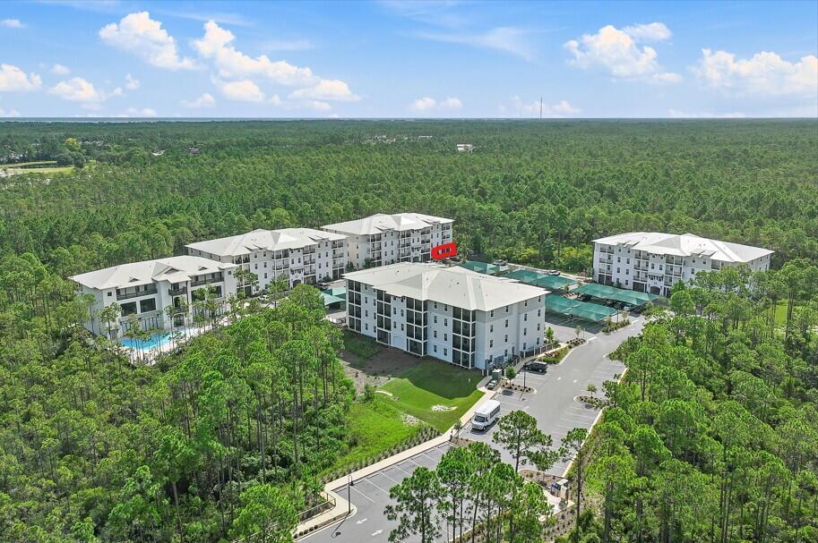 179 South County Highway 393, Unit 312 Santa Rosa Beach, FL 32459 - Photo 2 of 40 a view of a garden and swimming pool