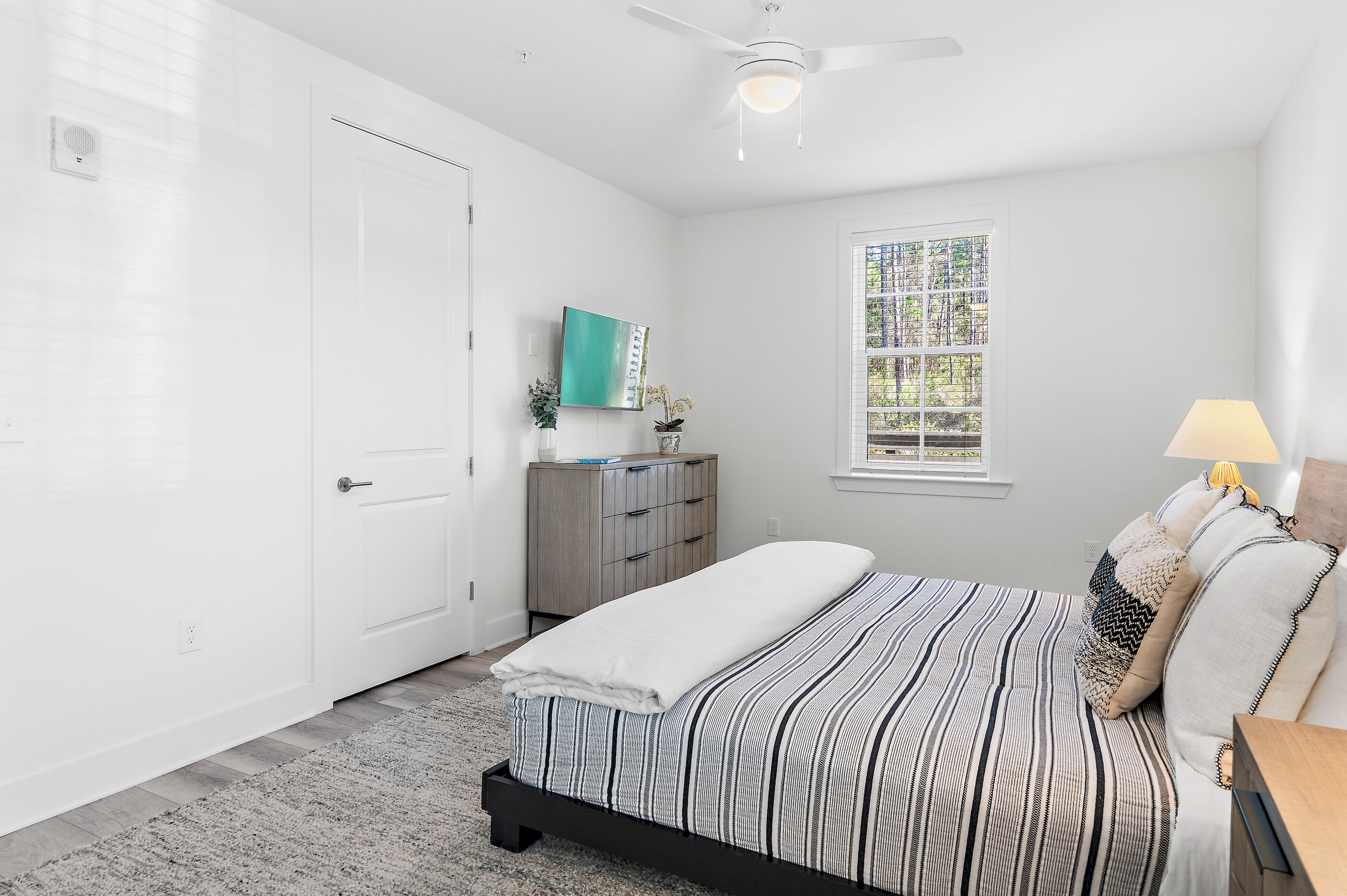179 South County Highway 393, Unit 312 Santa Rosa Beach, FL 32459 - Photo 22 of 40 a bedroom with a bed and a window