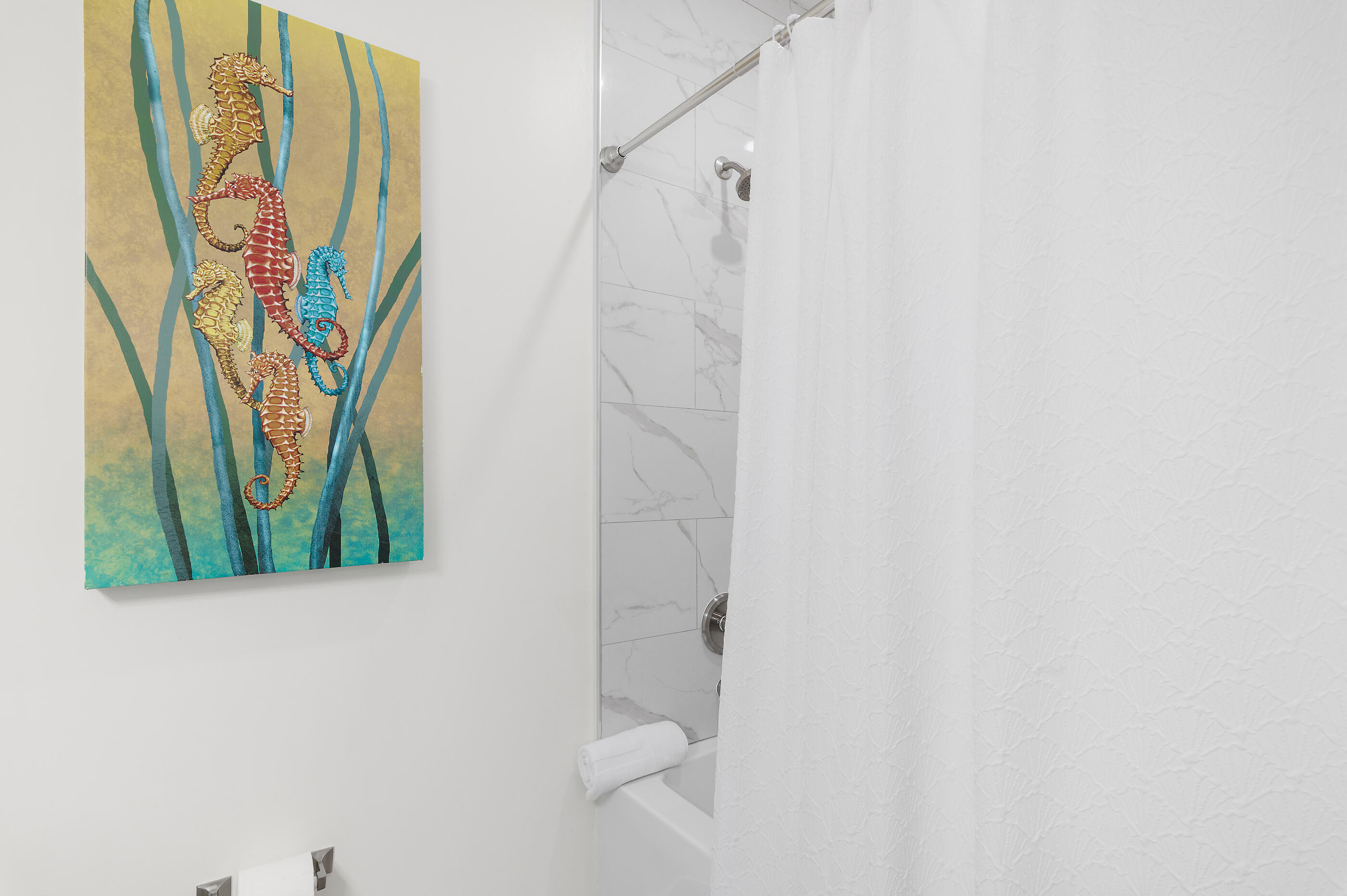 179 South County Highway 393, Unit 312 Santa Rosa Beach, FL 32459 - Photo 26 of 40 a bathroom with a shower curtain and a window