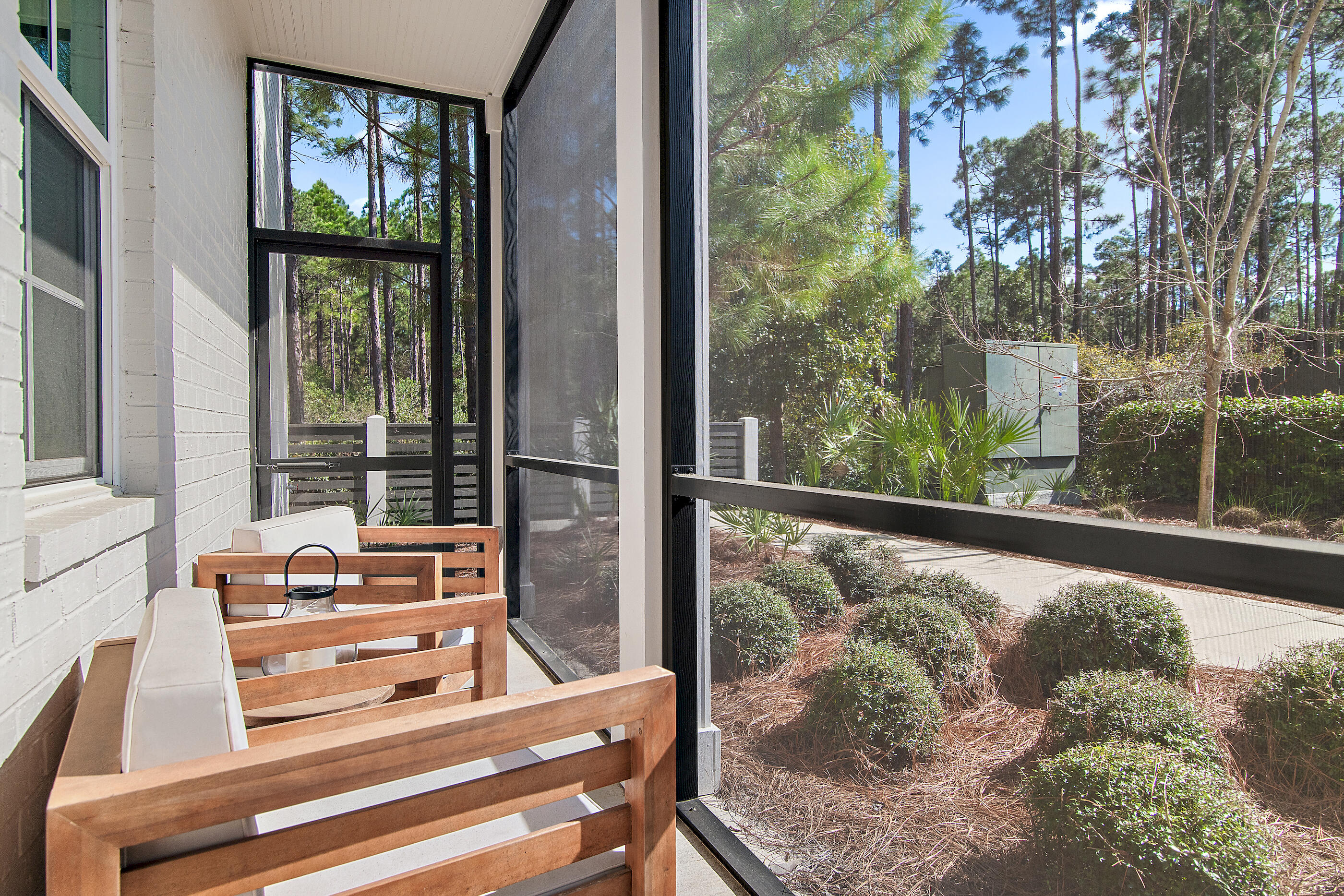 179 South County Highway 393, Unit 312 Santa Rosa Beach, FL 32459 - Photo 4 of 40 a view of a floor to ceiling window and a tree