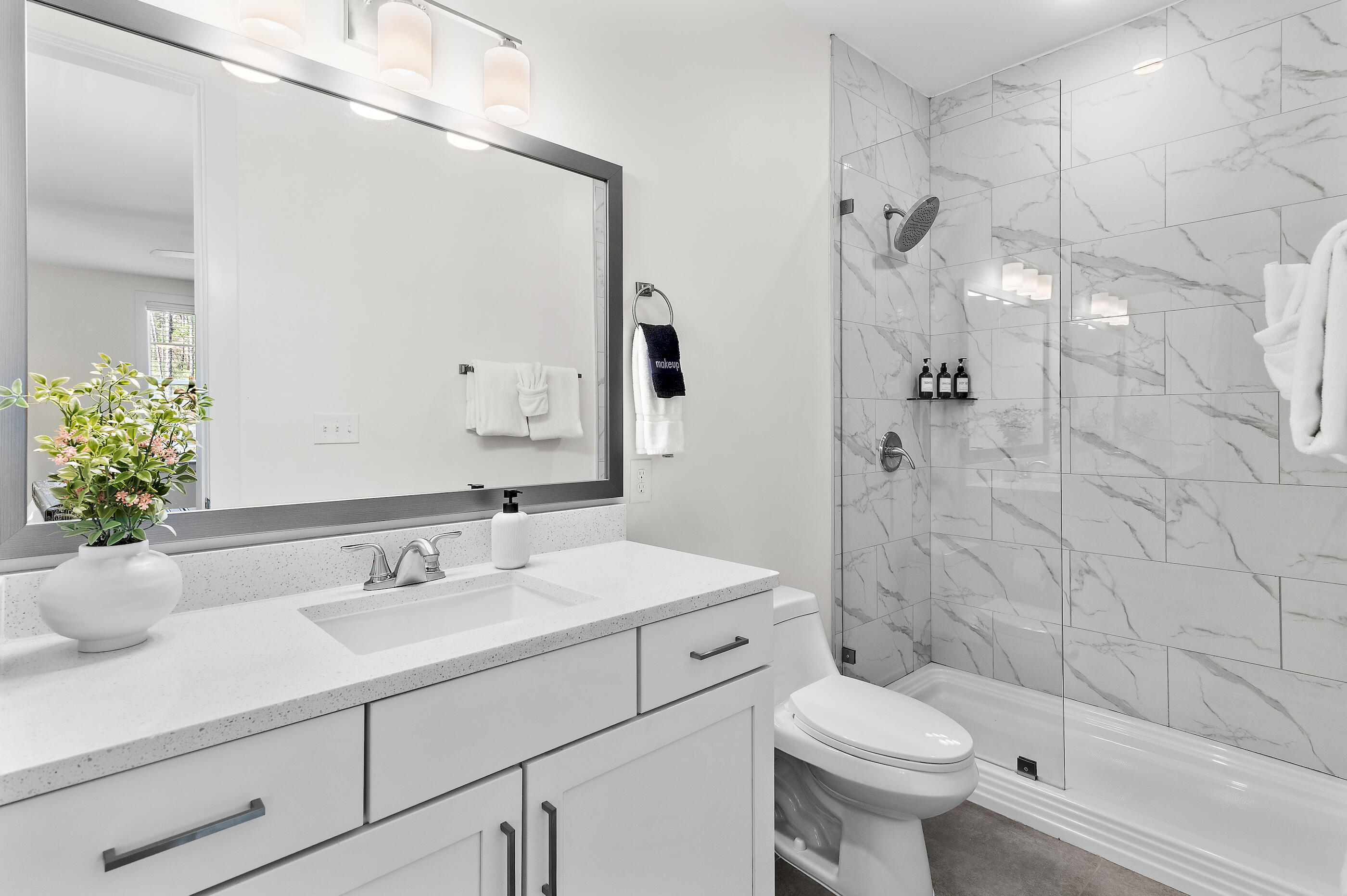 179 South County Highway 393, Unit 312 Santa Rosa Beach, FL 32459 - Photo 6 of 40 a bathroom with a sink toilet and shower