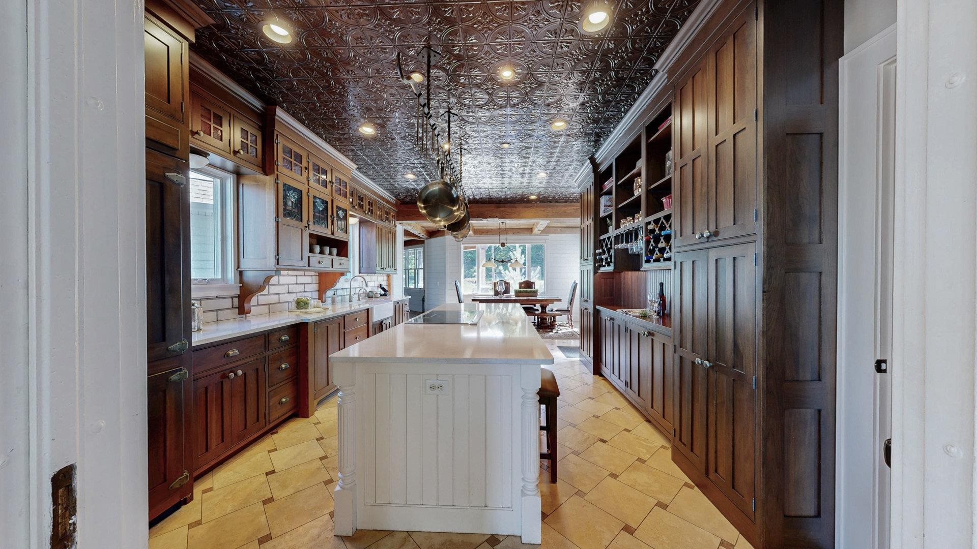 N1211 East Side Road Birchwood, WI 54817 - Photo 23 of 70 Kitchen with decorative light fixtures, an ornate ceiling, ornamental molding, open shelves, and a breakfast bar