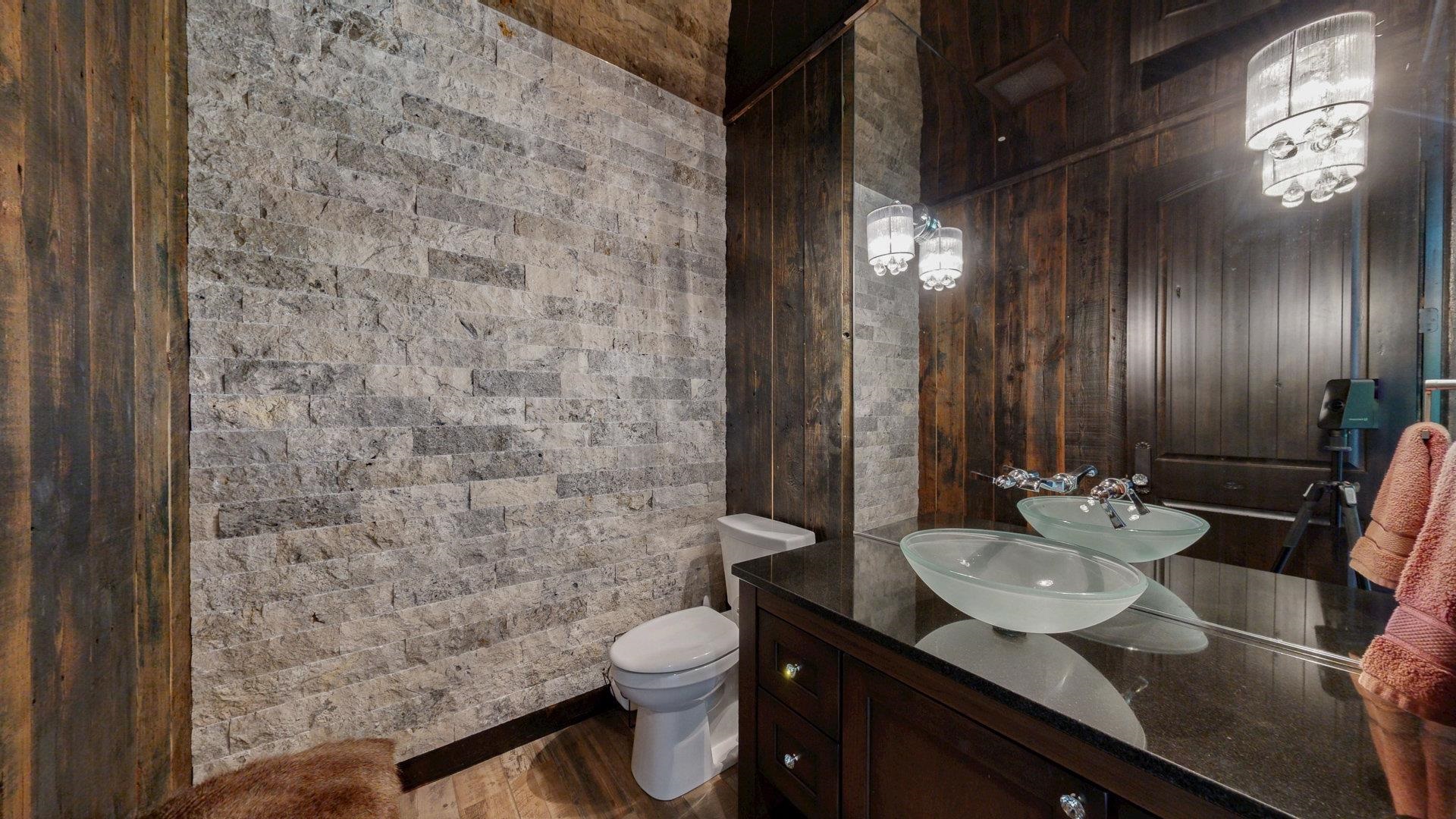 N1211 East Side Road Birchwood, WI 54817 - Photo 30 of 70 Bathroom with vanity, wood finished floors, and wooden walls