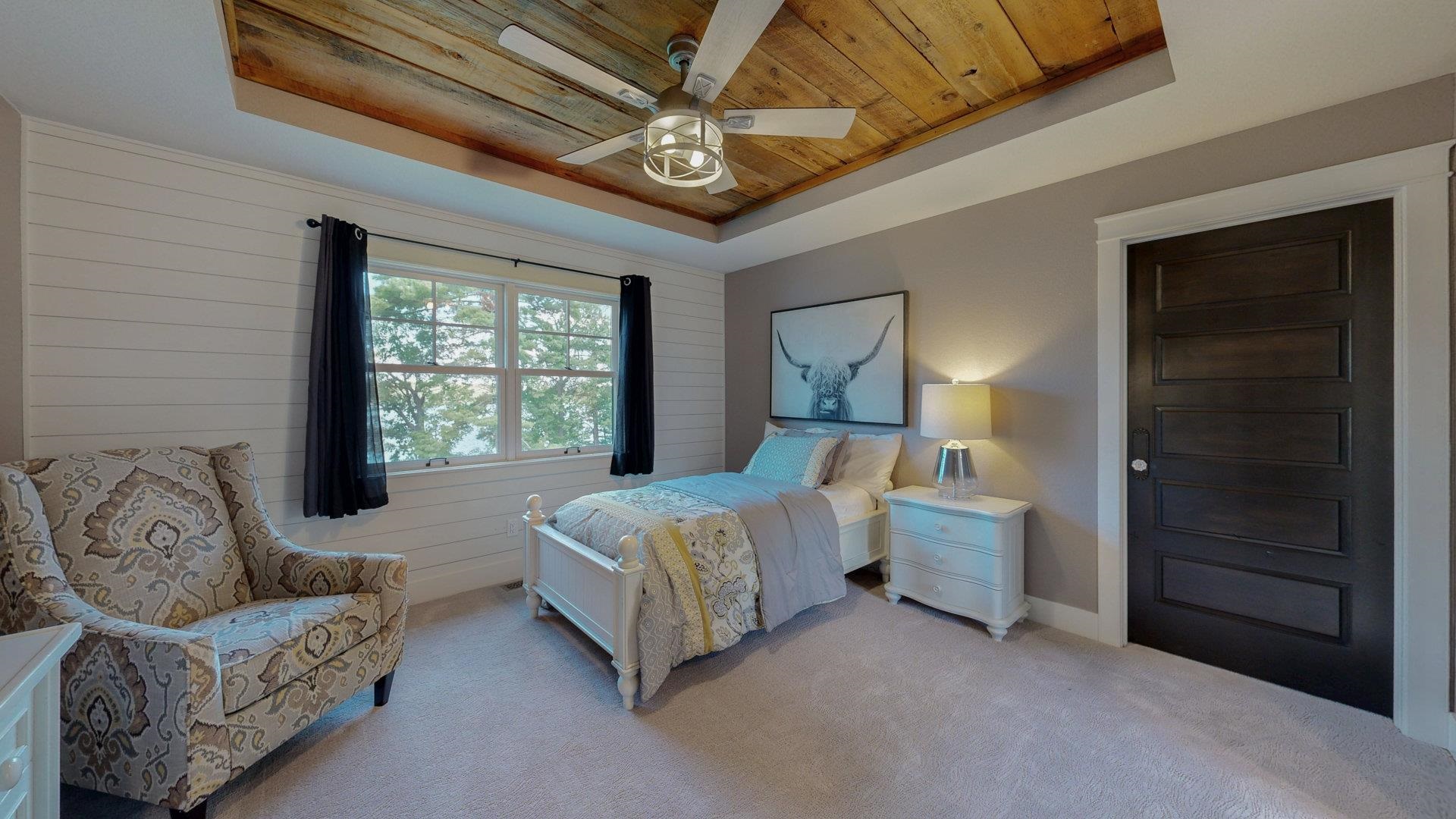 N1211 East Side Road Birchwood, WI 54817 - Photo 35 of 70 Bedroom featuring a raised ceiling, wooden ceiling, carpet, wooden walls, and a ceiling fan