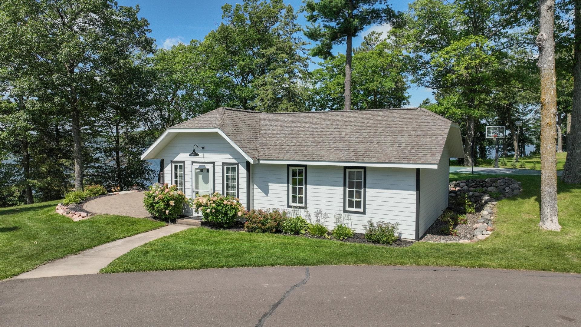 N1211 East Side Road Birchwood, WI 54817 - Photo 69 of 70 Single story home with a front yard and a shingled roof