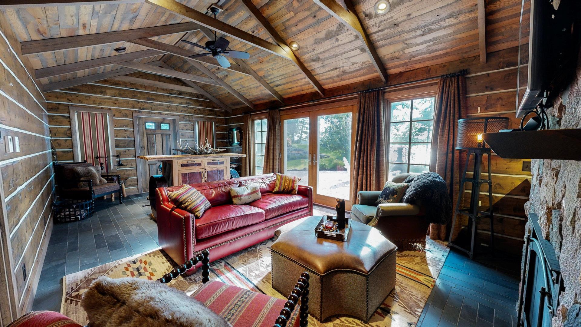 N1211 East Side Road Birchwood, WI 54817 - Photo 70 of 70 Living room with a wooden ceiling with exposed beams, hardwood / wood-style flooring, a fireplace, wood walls, and high vaulted ceiling