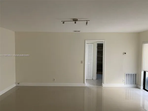 a bathroom with a sink and a washer dryer