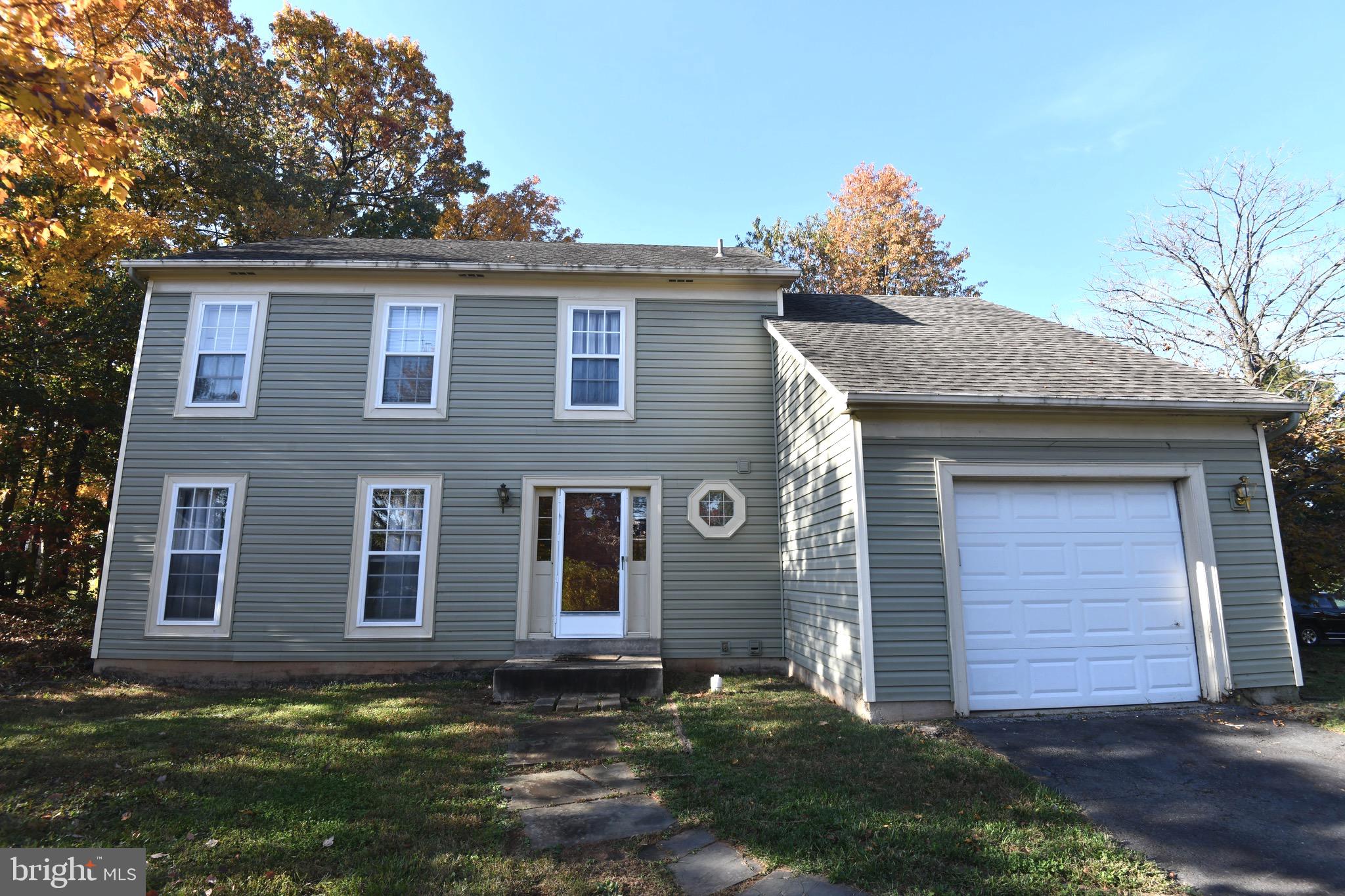 1052 Jeff Ryan Drive Herndon, VA 20170 - Photo 1 of 13 front view of a house with a yard
