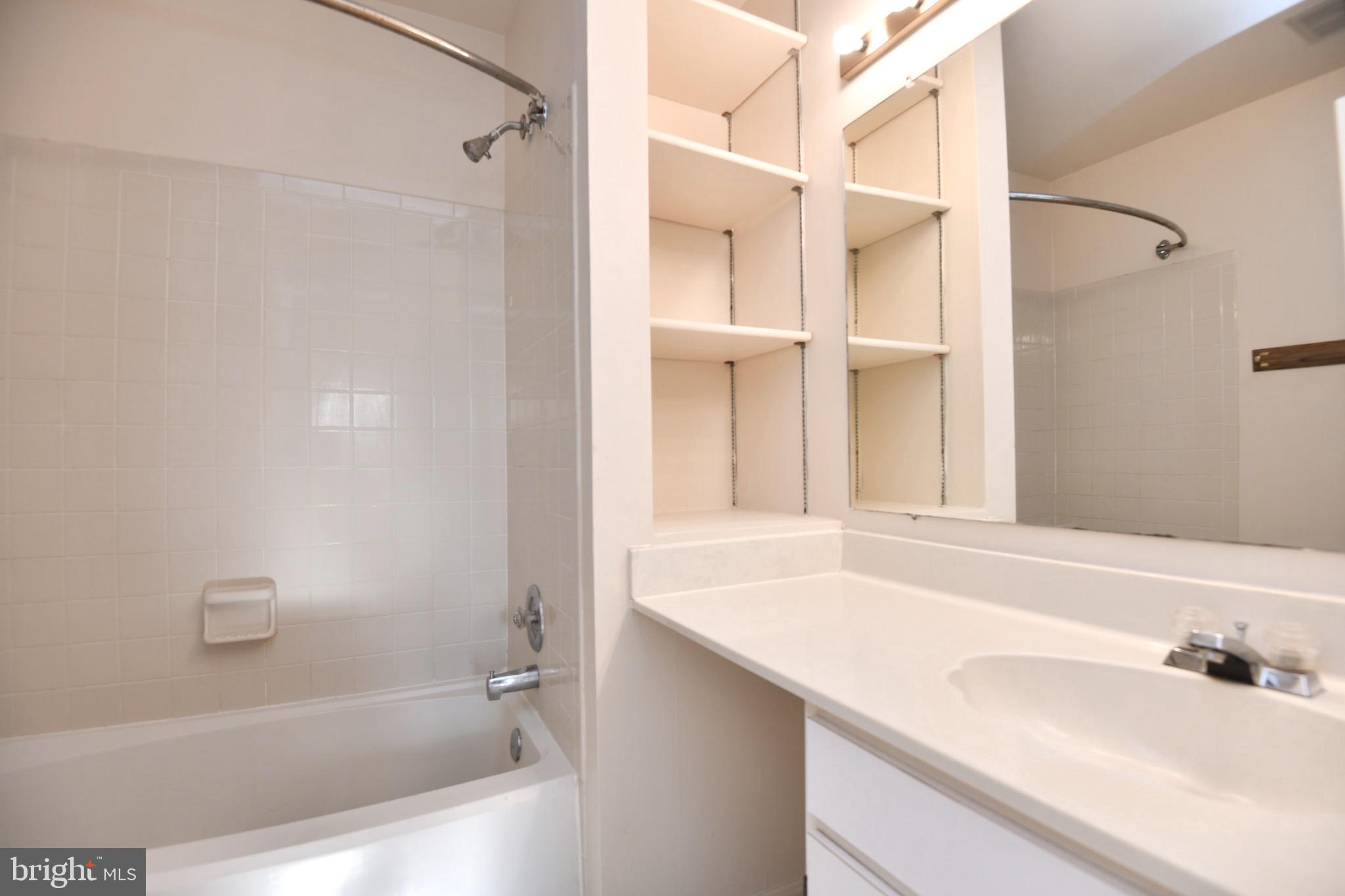 1052 Jeff Ryan Drive Herndon, VA 20170 - Photo 10 of 13 a bathroom with a sink and a mirror