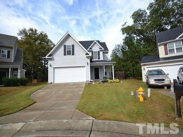 2800 Smooth Stone Trail Raleigh, NC 27610 - Photo 1 of 16 a view of a house with a patio and a yard