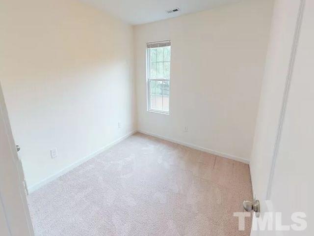 2800 Smooth Stone Trail Raleigh, NC 27610 - Photo 11 of 16 an empty room with a window