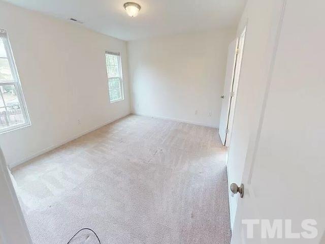 2800 Smooth Stone Trail Raleigh, NC 27610 - Photo 12 of 16 an empty room with windows