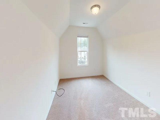 2800 Smooth Stone Trail Raleigh, NC 27610 - Photo 14 of 16 a view of an empty room with a window