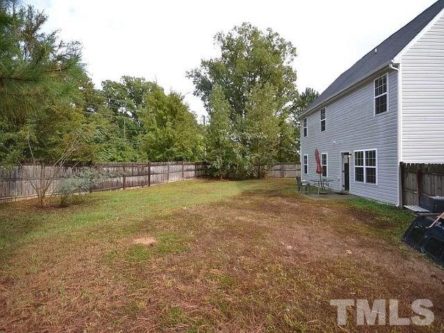 2800 Smooth Stone Trail Raleigh, NC 27610 - Photo 15 of 16 a view of a backyard with a small cabin
