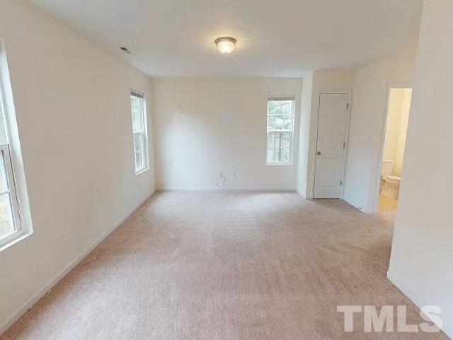 2800 Smooth Stone Trail Raleigh, NC 27610 - Photo 8 of 16 a view of an empty room with a window