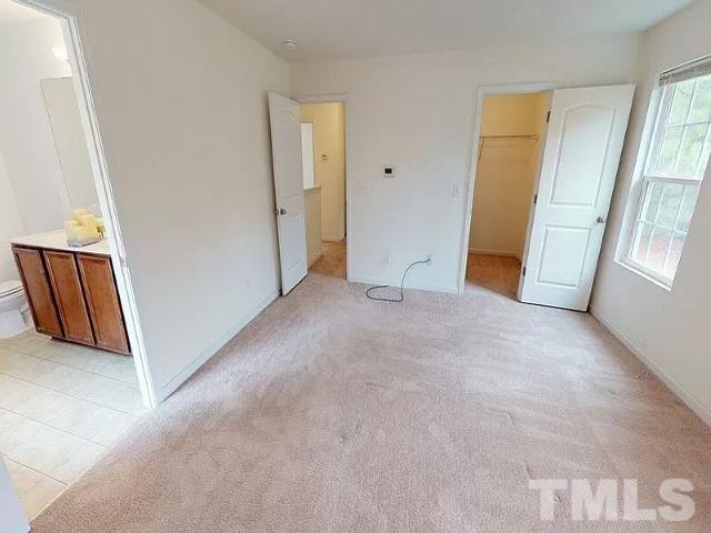 2800 Smooth Stone Trail Raleigh, NC 27610 - Photo 9 of 16 an empty room with windows and closet