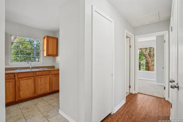 a view of a kitchen from the hallway