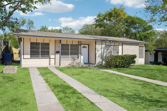 a view of a house that has a garden