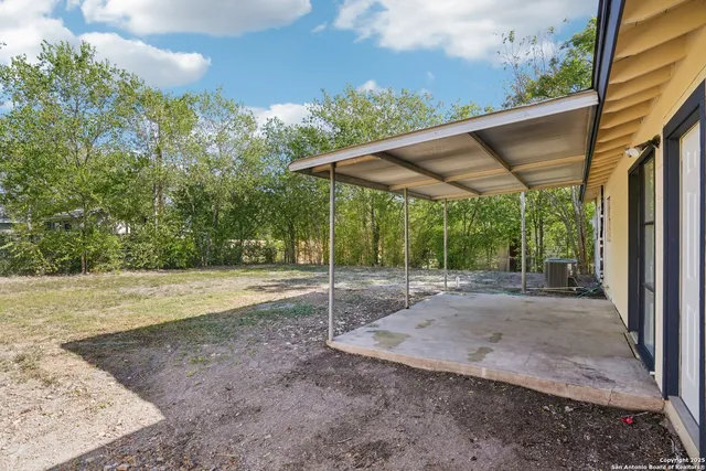 a view of a yard with a house and garden
