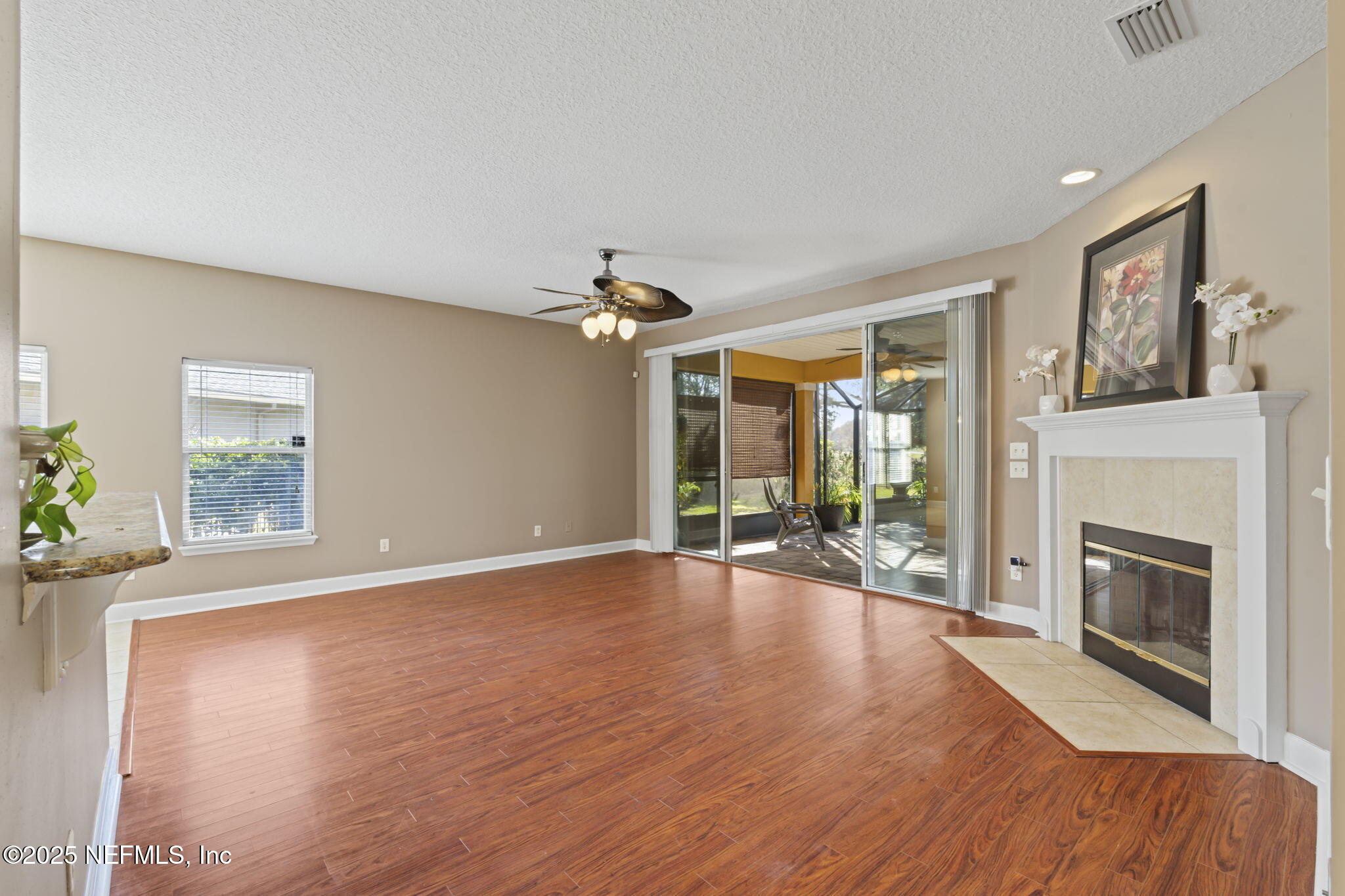 3370 Turkey Creek Drive Green Cove Springs, FL 32043 - Photo 16 of 44 a view of an empty room with window and wooden floor