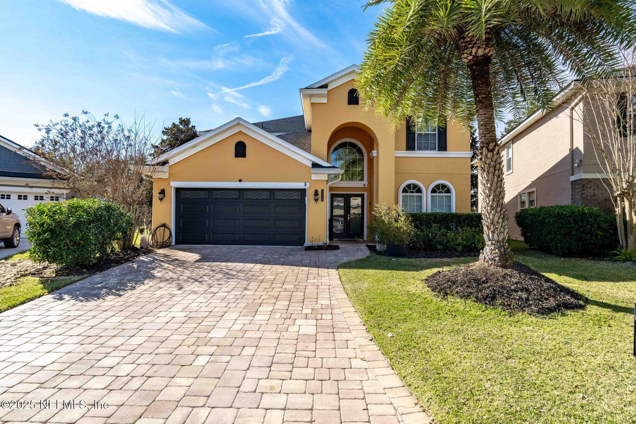 3370 Turkey Creek Drive Green Cove Springs, FL 32043 - Photo 2 of 44 a front view of a house with a yard and garage